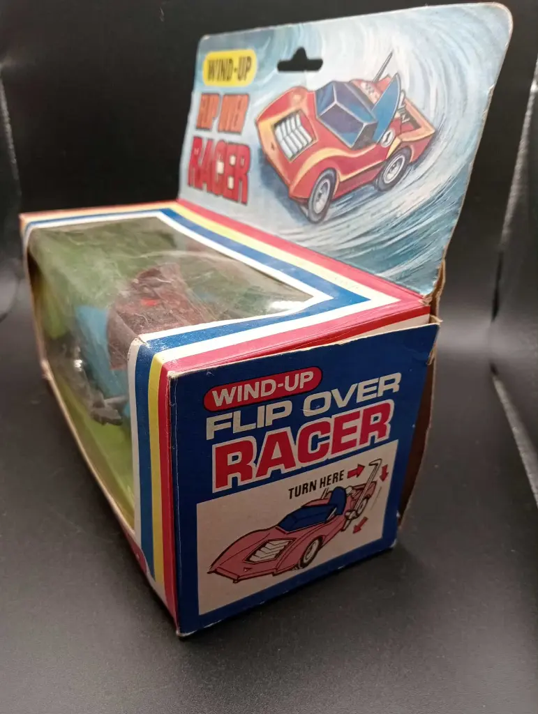 Voiture jouet Flip Over Racer à ressort vintage + boîte