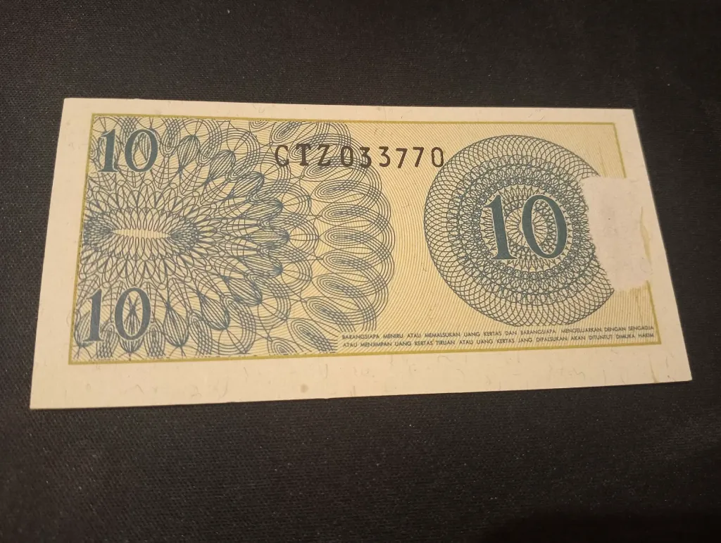 Billet 10 sen Indonésie 1964 – volontaire en uniforme & avertissement légal