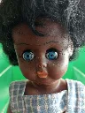 Poupée rétro au teint chocolat.webp