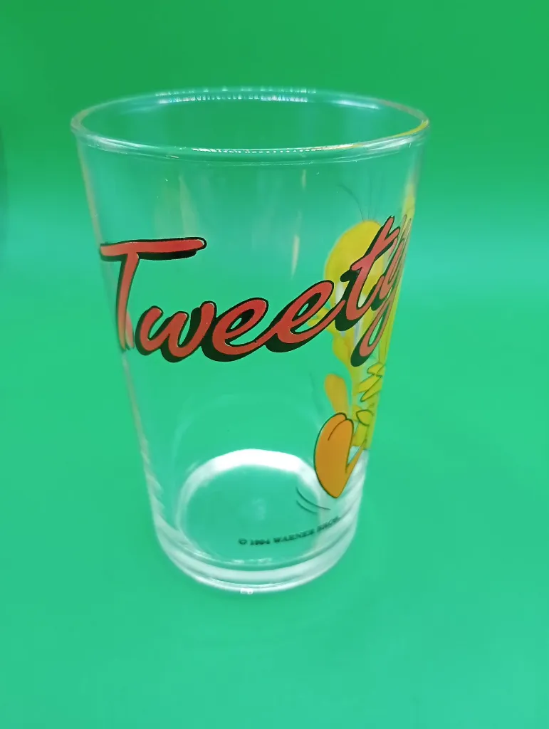 Verre Tweety 1994 – Looney Tunes – décor jaune – texte Tweety – Warner Bros