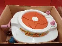 ouet Matchbox Stack‑a‑Cake vintage – boîte d’origine – jouet musical à plateau tournant – éléments roses et orange – état fonctionnel avec aide au mouvement