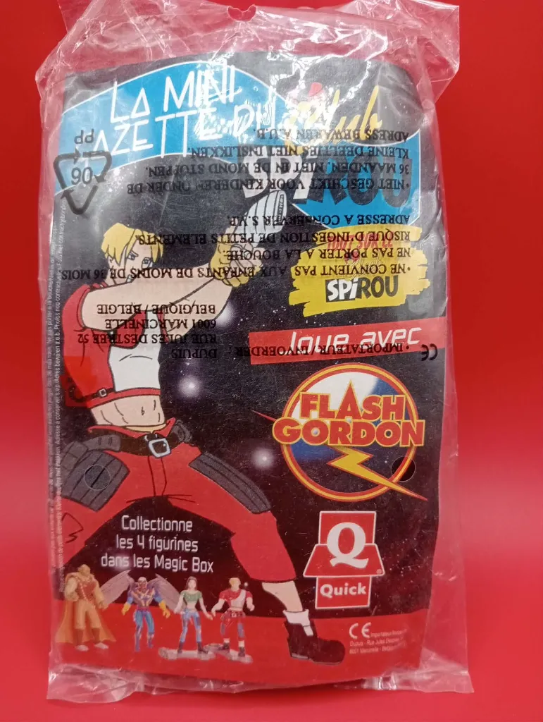 Figurine Dale Arden – Quick – 1998 – Jouet de fast-food sous sachet scellé – vintage – personnage féminin aux cheveux noirs portant un haut vert court et un pantalon bleu avec accessoire de planche de skate gris