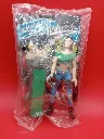 Figurine Dale Arden – Quick – 1998 – Jouet de fast-food sous sachet scellé – vintage – personnage féminin aux cheveux noirs portant un haut vert court et un pantalon bleu avec accessoire de planche de skate gris