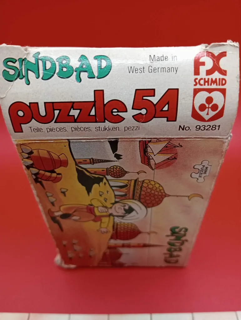 Mini-puzzle Sindbad – FX Schmid – 1978 – jeu de patience miniature en carton – vintage – boîte rectangulaire illustrée montrant Sindbad devant des palais orientaux avec logo trèfle rouge FX Schmid et mention Made in West Germany