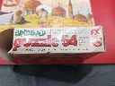Mini-puzzle Sindbad – FX Schmid – 1978 – jeu de patience miniature en carton – vintage – boîte rectangulaire illustrée montrant Sindbad devant des palais orientaux avec logo trèfle rouge FX Schmid et mention Made in West Germany