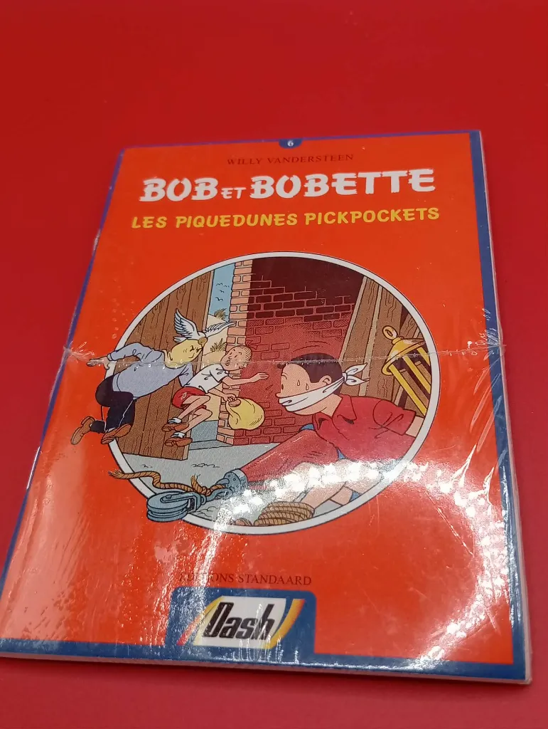 Mini album Bob et Bobette Les Piquedunes Pickpockets – Willy Vandersteen – Éditions Standaard – livret promotionnel Dash – bilingue français néerlandais – sous emballage d'origine non ouvert
