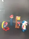 Lot de 4 figurines Super Mario Bros – Nintendo – Mario volant, distributeur PEZ Mario, Mario bloc mystère et Mario Koopa ailé – figurines en plastique colorées – état d’usage