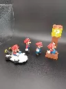 Lot de 4 figurines Super Mario Nintendo – Mario en kart, Mario classique, Mario sous bloc mystère et Mario personnage ailé – figurines en plastique – couleurs d’origine – état d’usage