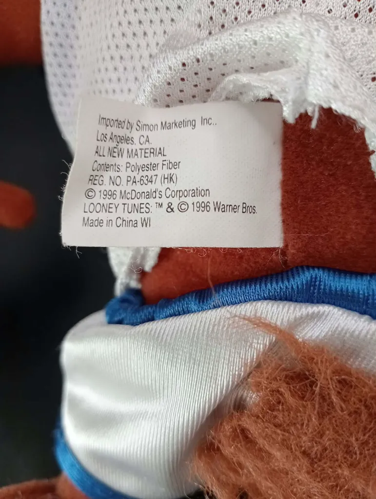 Peluche Taz Space Jam 1996 Warner Bros et McDonald's avec maillot de basket blanc et bleu, étiquette d'origine présente