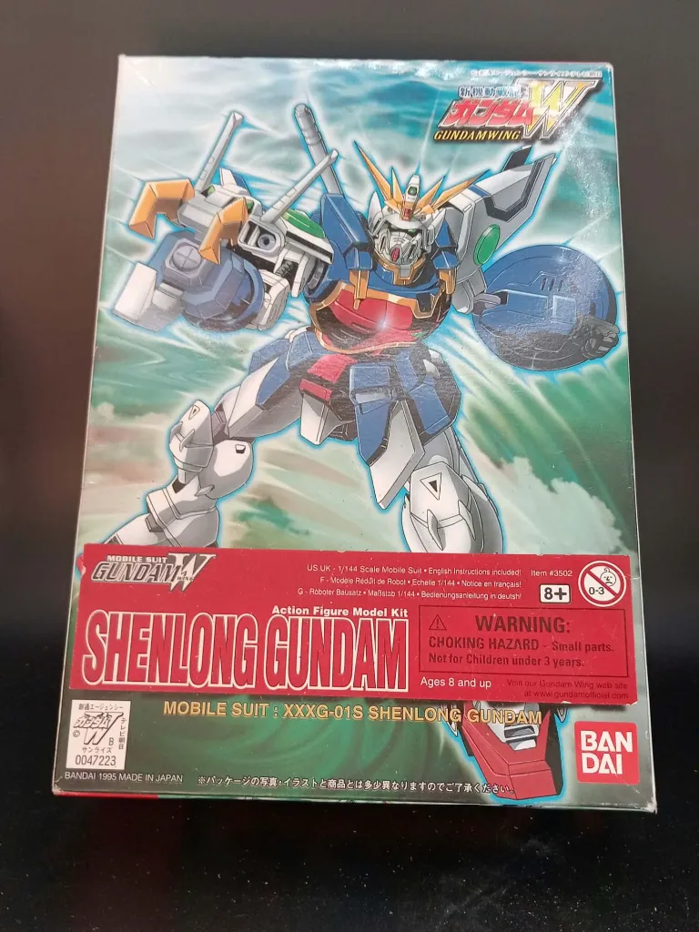 Kit épave Shenlong Gundam XXXG-01S Bandai 1995 échelle 1/144, figurine montée incomplète et endommagée avec antenne cassée et boîte d’origine abîmée