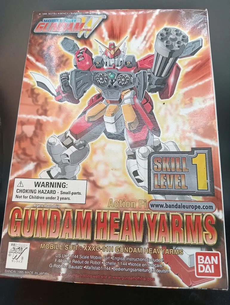 Gundam Heavyarms XXXG-01H Bandai 1995 à l’échelle 1/144, maquette montée en boîte avec petite cassure sur l’emblème jaune de la tête