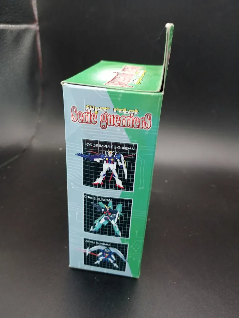 Ancienne maquette non officielle Force Impulse Gundam Série Guerriers distribuée sous la marque DM Mangas, pièces couleur rouge sous sachet, boîte et notice illustrée
