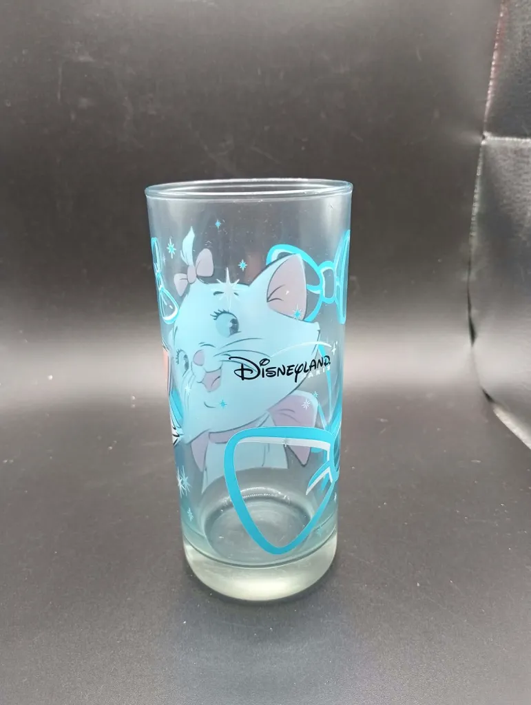 Tall transparent blue Marie Portrait glass from The Aristocats with turquoise bows, stars and Disneyland Resort Paris logo