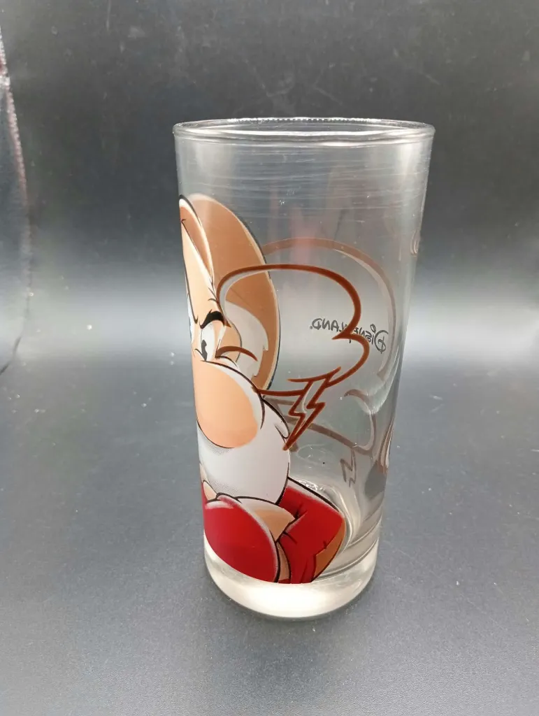 Transparent Disney Grumpy portrait glass with brown red and white decoration, clouds, lightning and Disneyland Paris logo