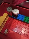 1986 LEGO DUPLO 2770 play house stored in a red and silver carrying case with transparent front, figures, kitchen, bathroom, beds and furniture
