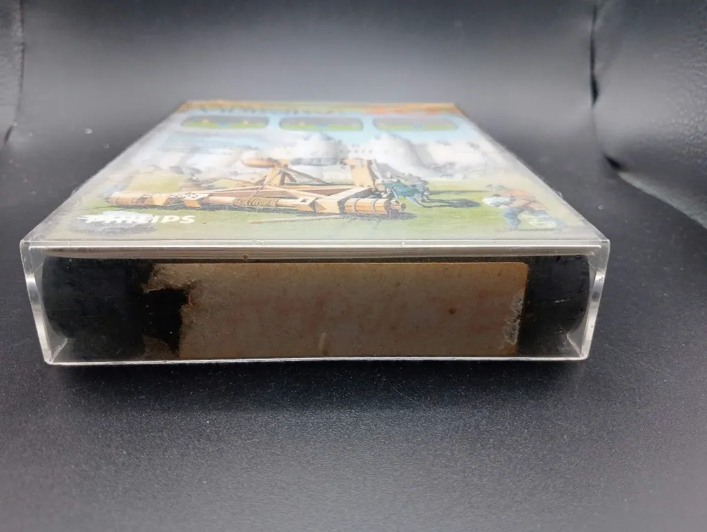Retro Philips Videopac 20 Stone Sling game from 1980 with black cartridge, medieval catapult hard case and original manual