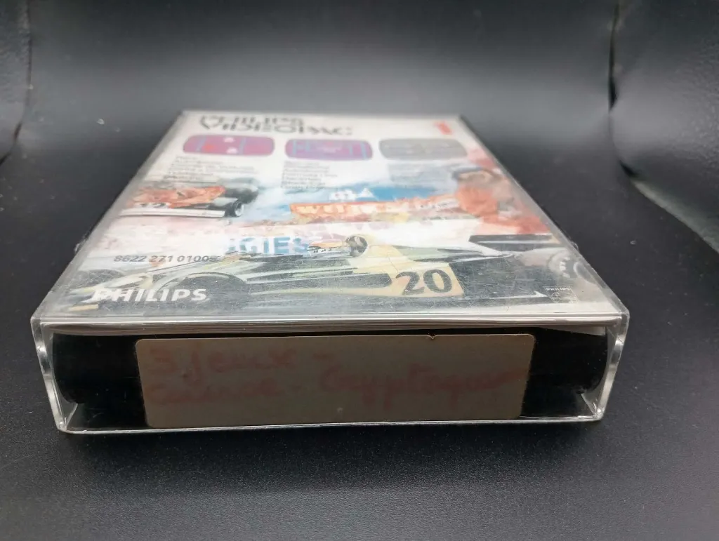 Juego retro Philips Videopac 1 Race Spin-Out Cryptogram de 1980 con cartucho negro, caja ilustrada con coches de carreras y manual original