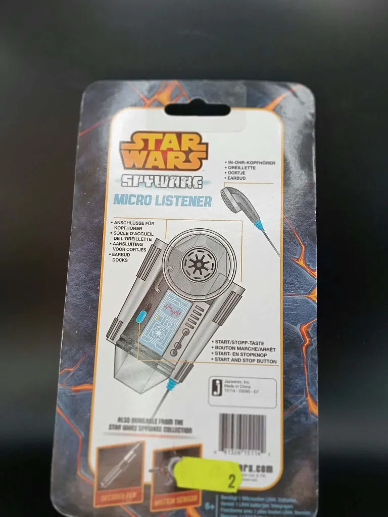 Elektronische Star Wars Spyware Micro Listener van Jazwares in blister, grijze geluidsversterker met keizerlijk symbool en zwart oortje