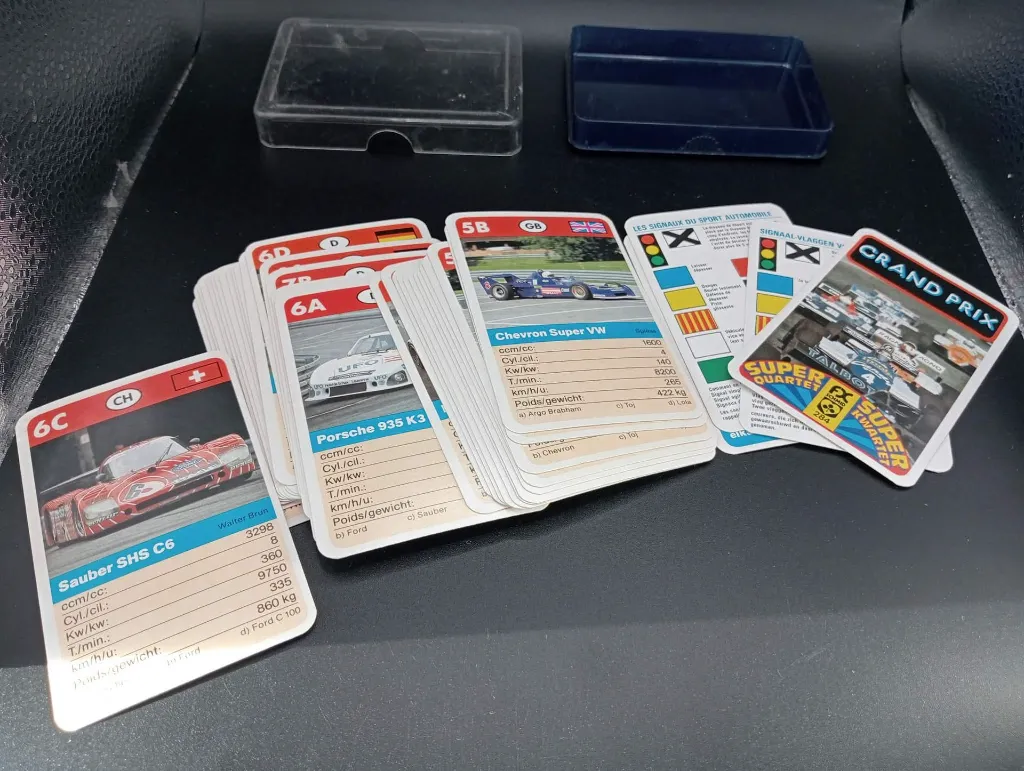Vintage Grand Prix Super Quartet FX Schmid 284 card game with illustrated racing cars, technical specifications and original transparent plastic case