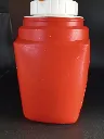 Thermos vintage rosso Roughneck con Snoopy e Woodstock, tappo bianco con levetta arancione e tazza esterna mancante