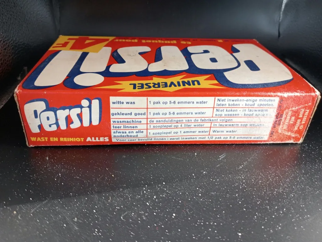 Vintage full and closed Belgian Persil Universal cardboard detergent box in red blue white and yellow with 4 Belgian franc promotion and bilingual instructions