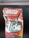 Vintage full bilingual Tide Blue Point detergent box with cutlery promotion, 4.75-franc price, red yellow and blue cardboard and heavily torn upper opening