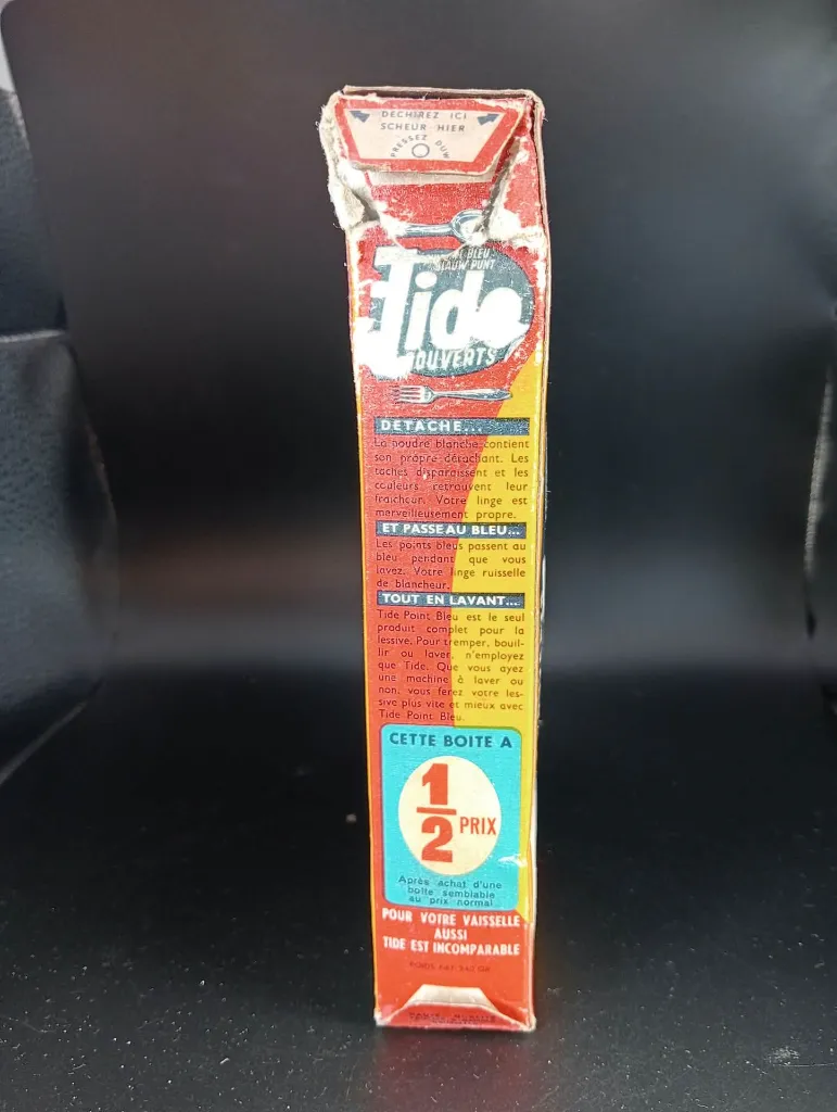Alte volle zweisprachige Tide Blauer Punkt Waschmittelpackung mit Besteckwerbung, Preis von 4,75 Franken und stark beschädigter oberer Öffnung