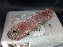 Vintage mechanical STB Swiss Made pigeon racing clock in hammered grey metal with white dial number 67992, side closure with metal seal and heavily cracked red leather handle