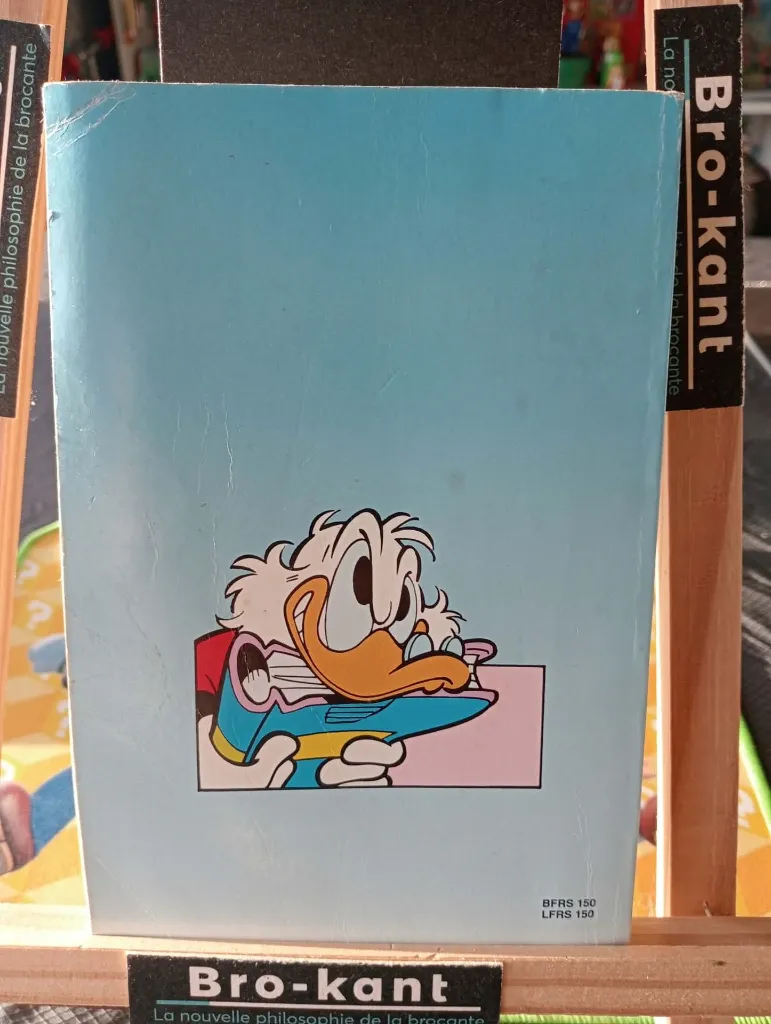Banda desenhada alemã Walt Disney Lustiges Taschenbuch número 195 Der Wildbach-Marathon de 1994 com Donald Duck e outros participantes em canoas num rio agitado