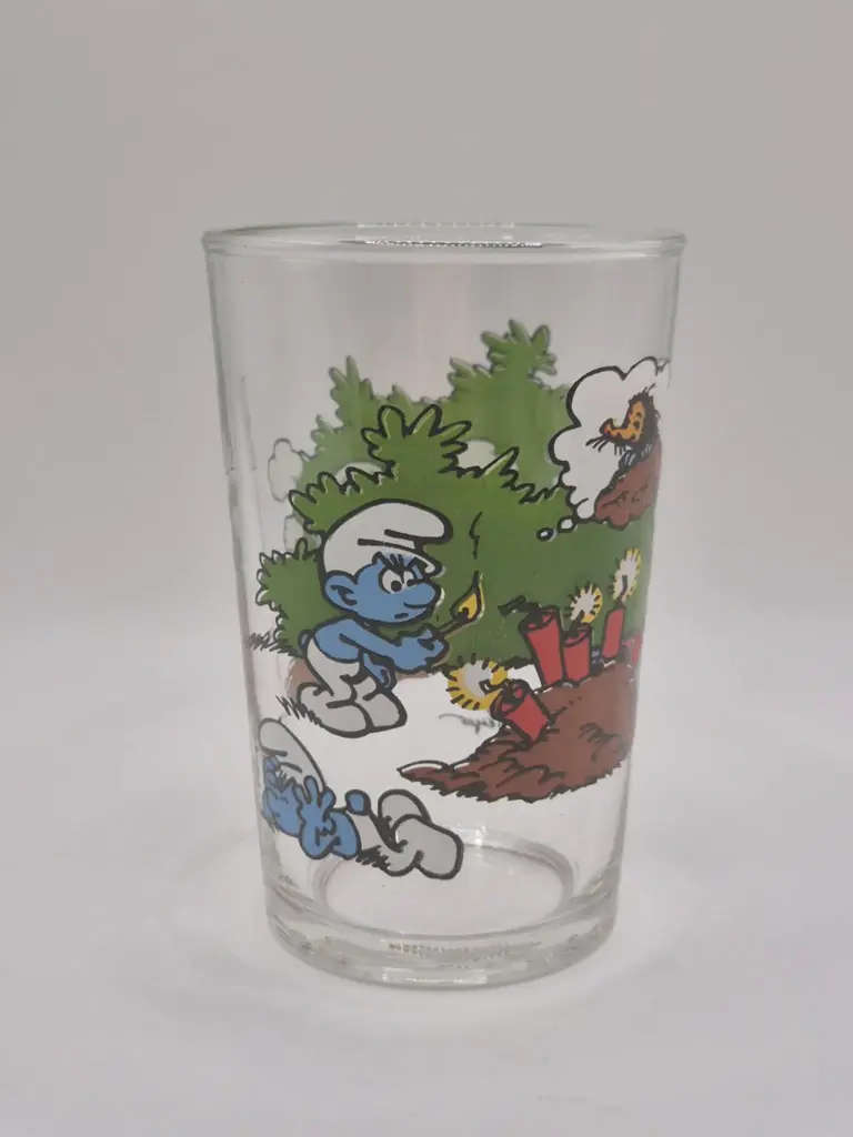 Verre schtroumpfs Bénédictin 1994 - explosion d'un trou de taupe