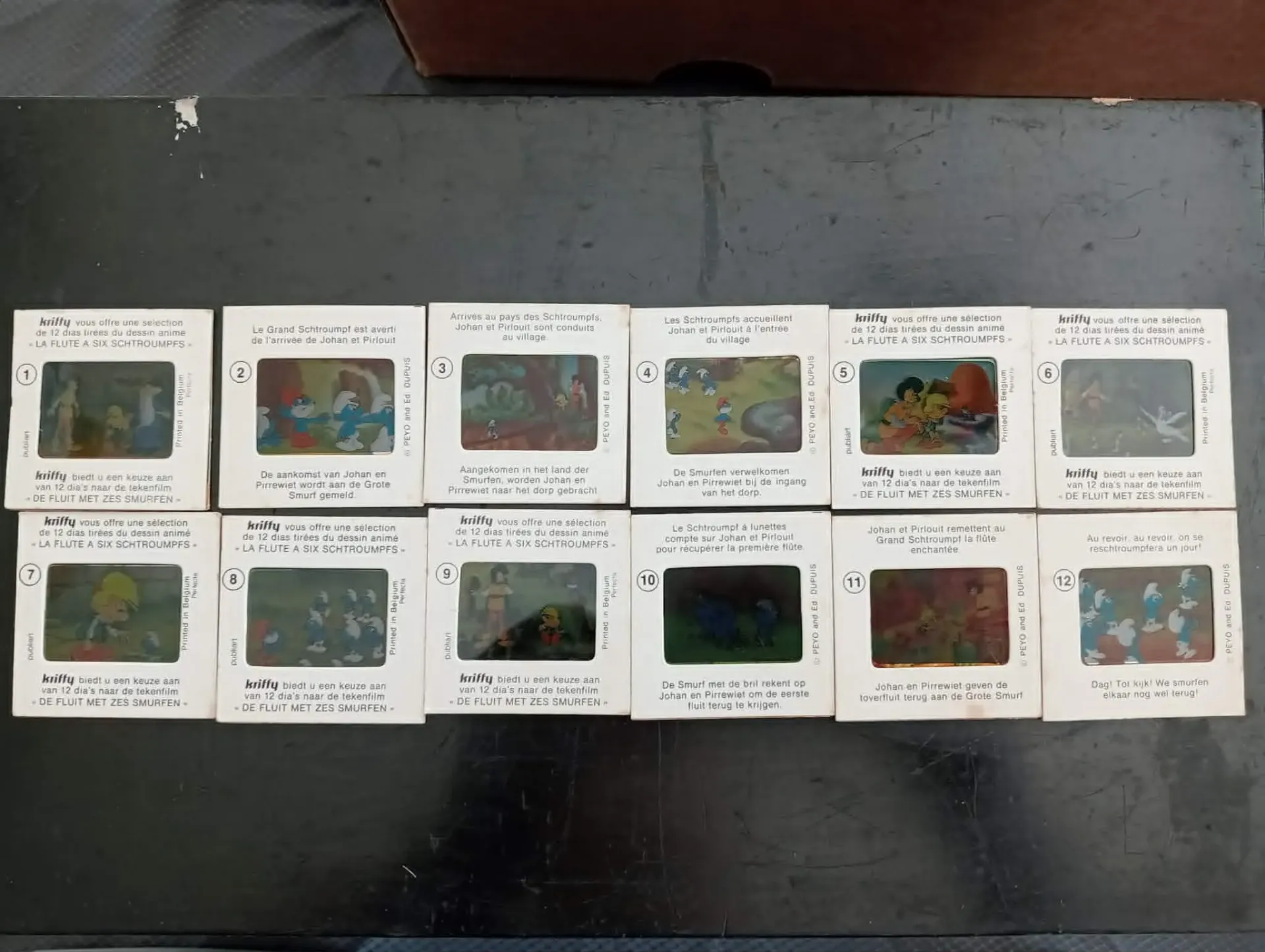 Serie completa di 12 diapositive Kriffy – Il flauto a sei Puffi – Belgio 1975
