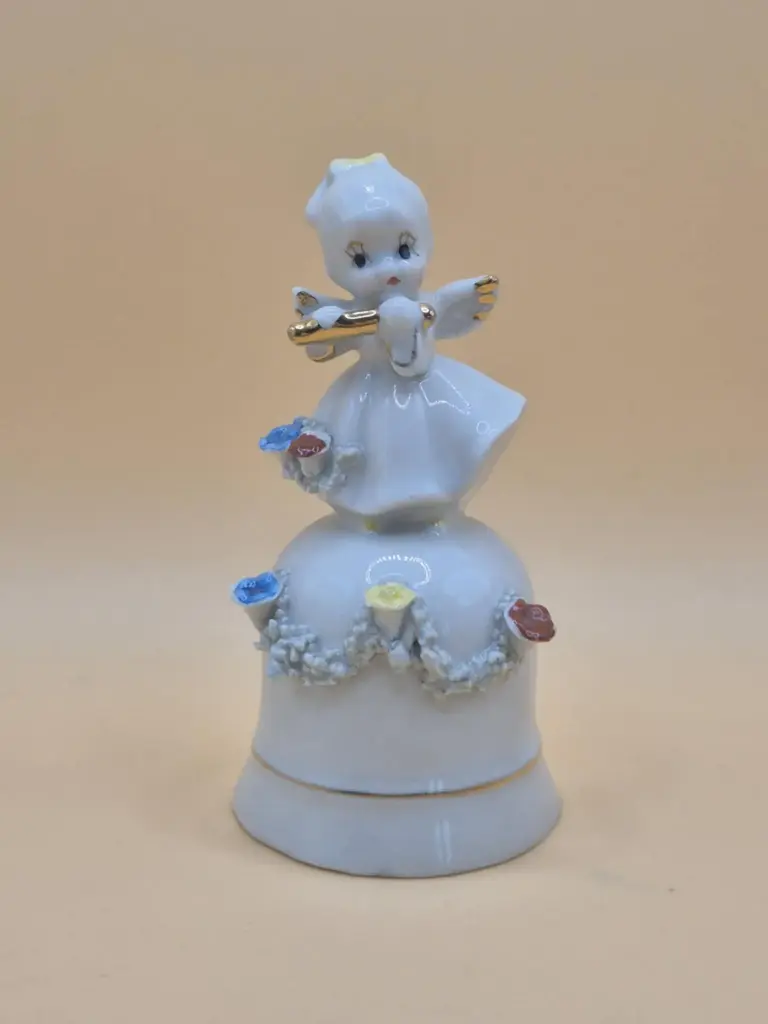 Porcelain bell – little girl with flute – unsigned