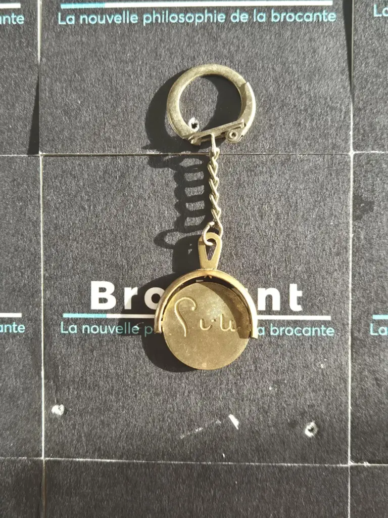 Vintage thaumatroop‑sleutelhanger – Lutti snoep (jaren 60)