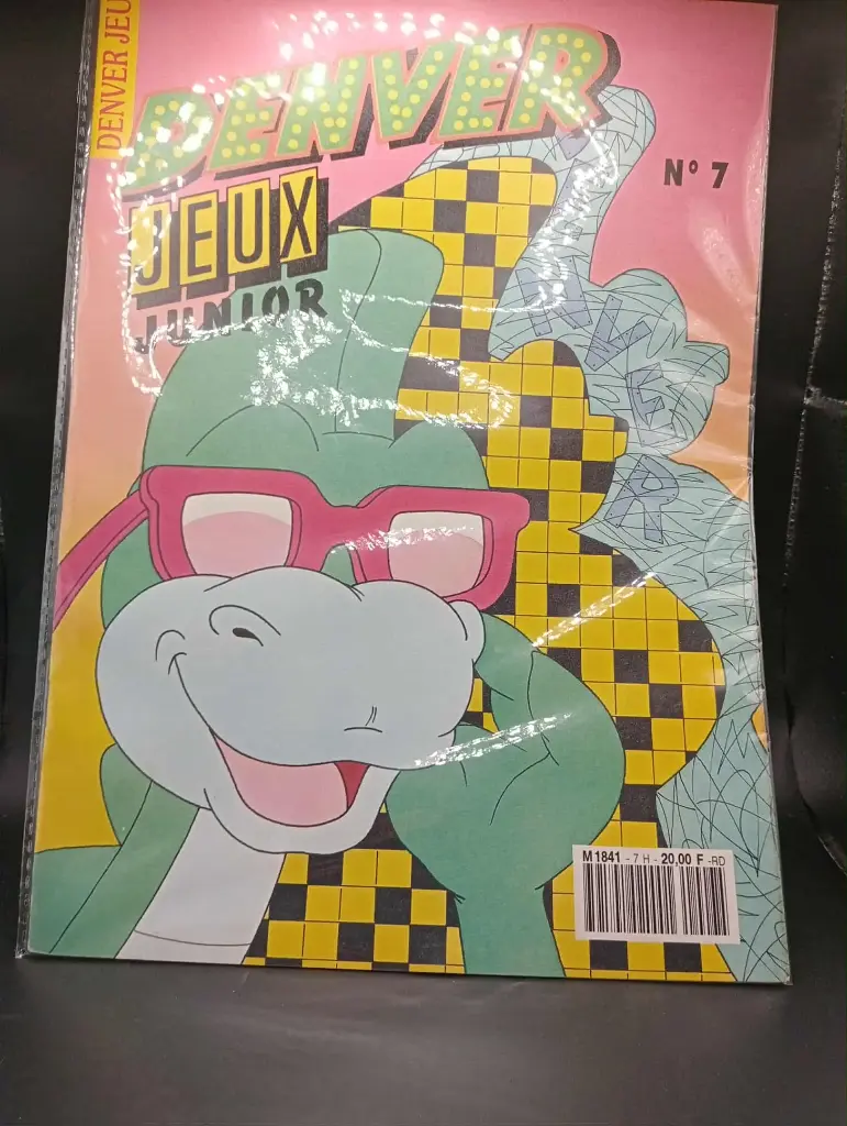 Denver n.7, occhiali rossi, umorismo verde. Dinosauro anni '90.