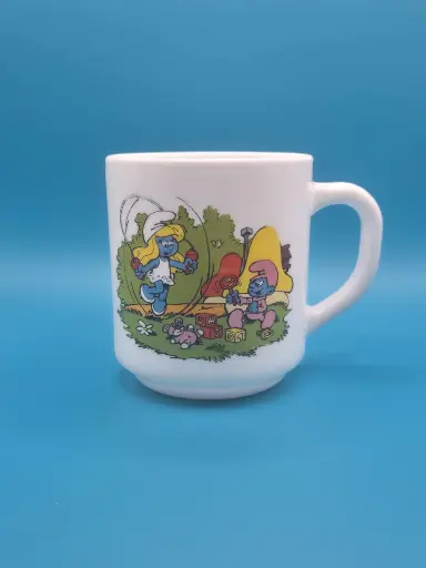 Tasse schtroumpfs Bénédictin 1984 - les schtroumpfs amusent le bébé schtroumpfs