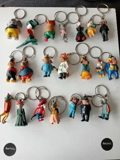 🧸 Collection de 21 porte-clés De Betuwe – Série 1966 – Figurines publicitaires