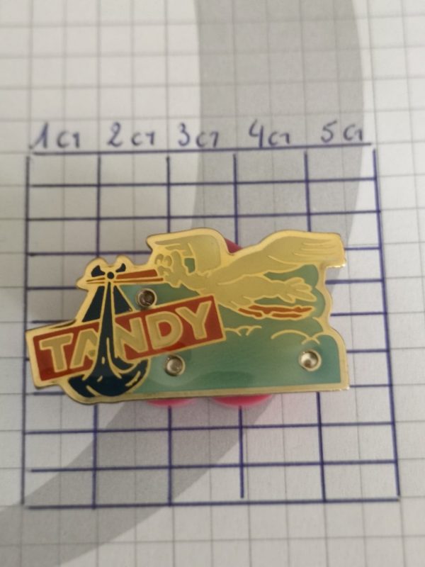 Pin's : Tandy lumineux - cigogne